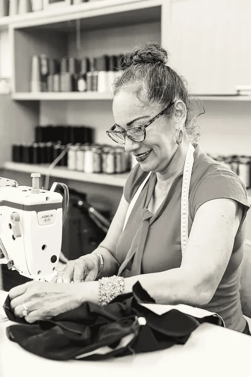 Single Mother Sewing at Tulum Fashions