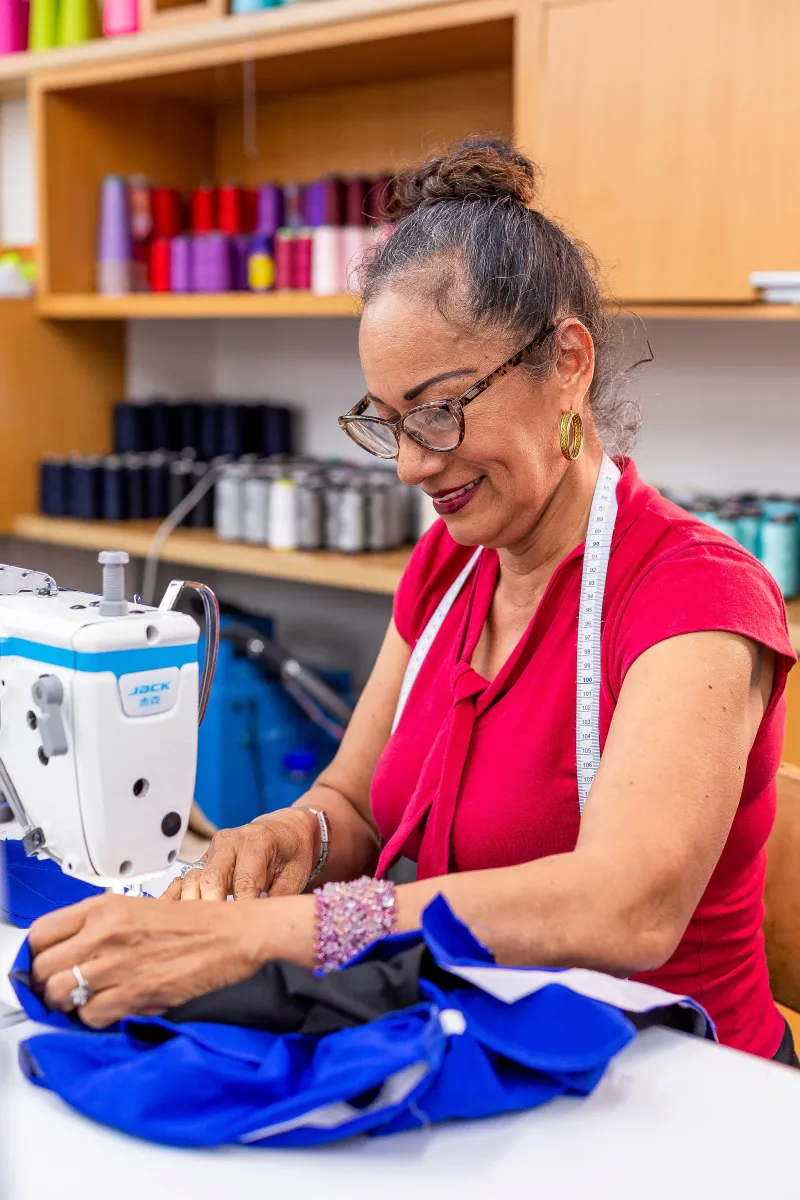 Single Mother Sewing at Tulum Fashions